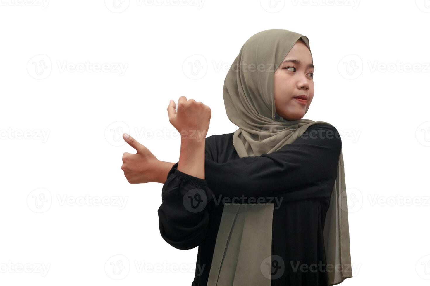 Muslim Woman Stretching Arms in Hijab photo