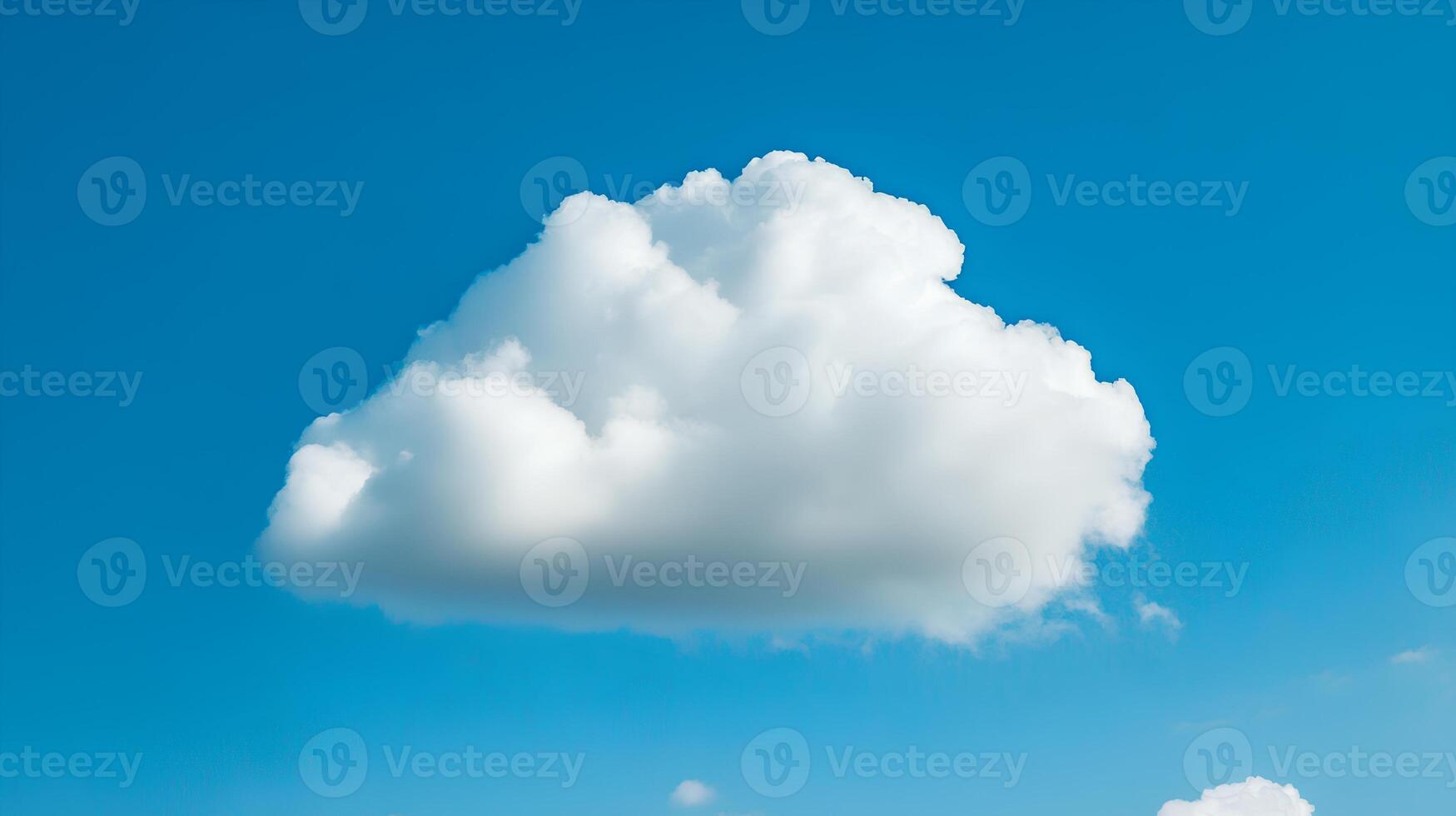 Fluffy White Cloud Against Bright Blue Sky on Sunny Day photo