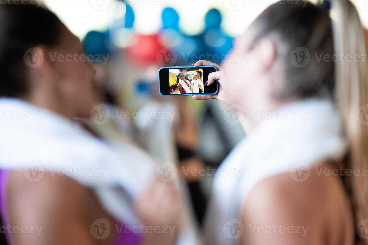 Two fitness women posing for a photoshoot after an intense workout, capturing their strength, determination, and fitness journey. photo
