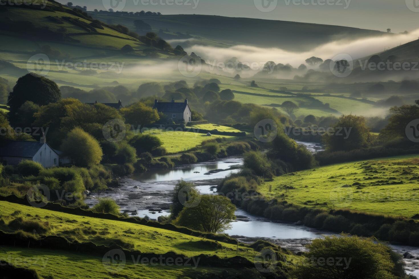A river runs through a green valley with houses on either side photo