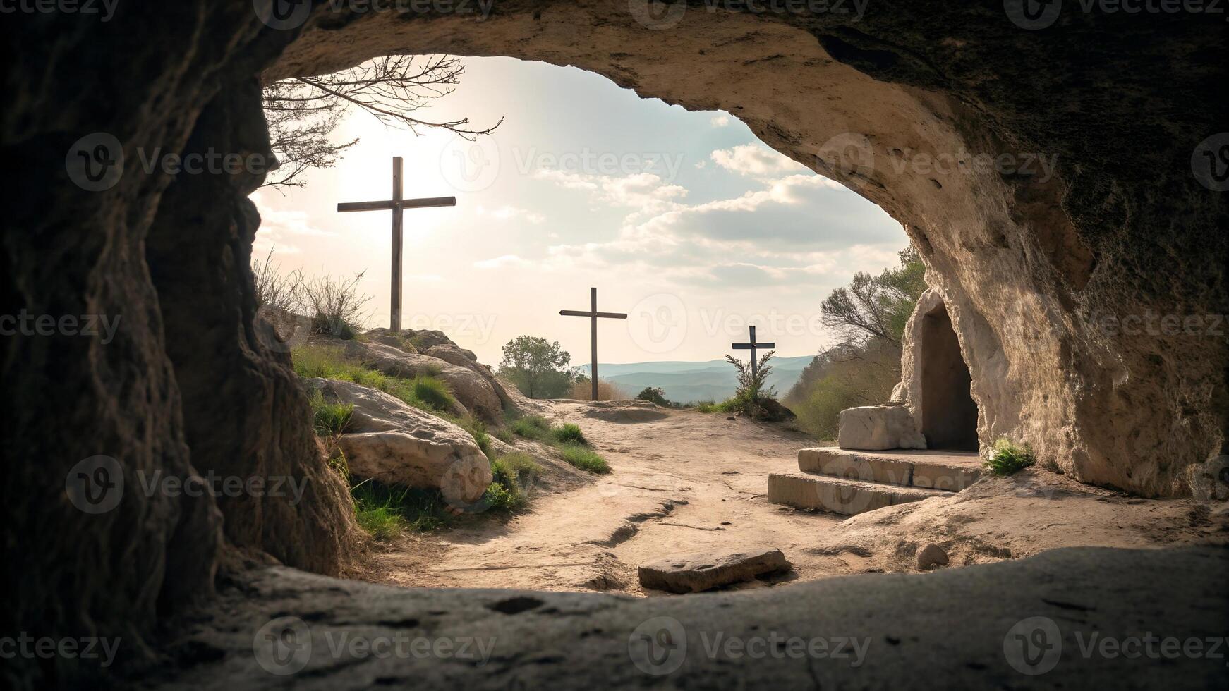 View of cross monuments from within a cave at sunset photo