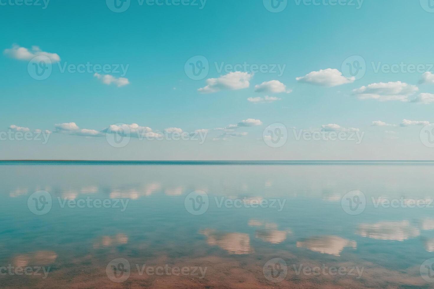 Serene reflection over calm waters under bright blue sky photo