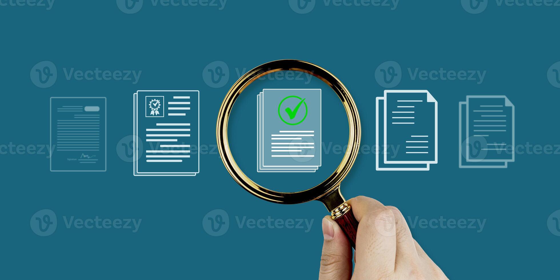 A hand holds a magnifying glass focusing on a document icon with a checkmark. Document search system, item inspection, quality control, and standards certification. photo
