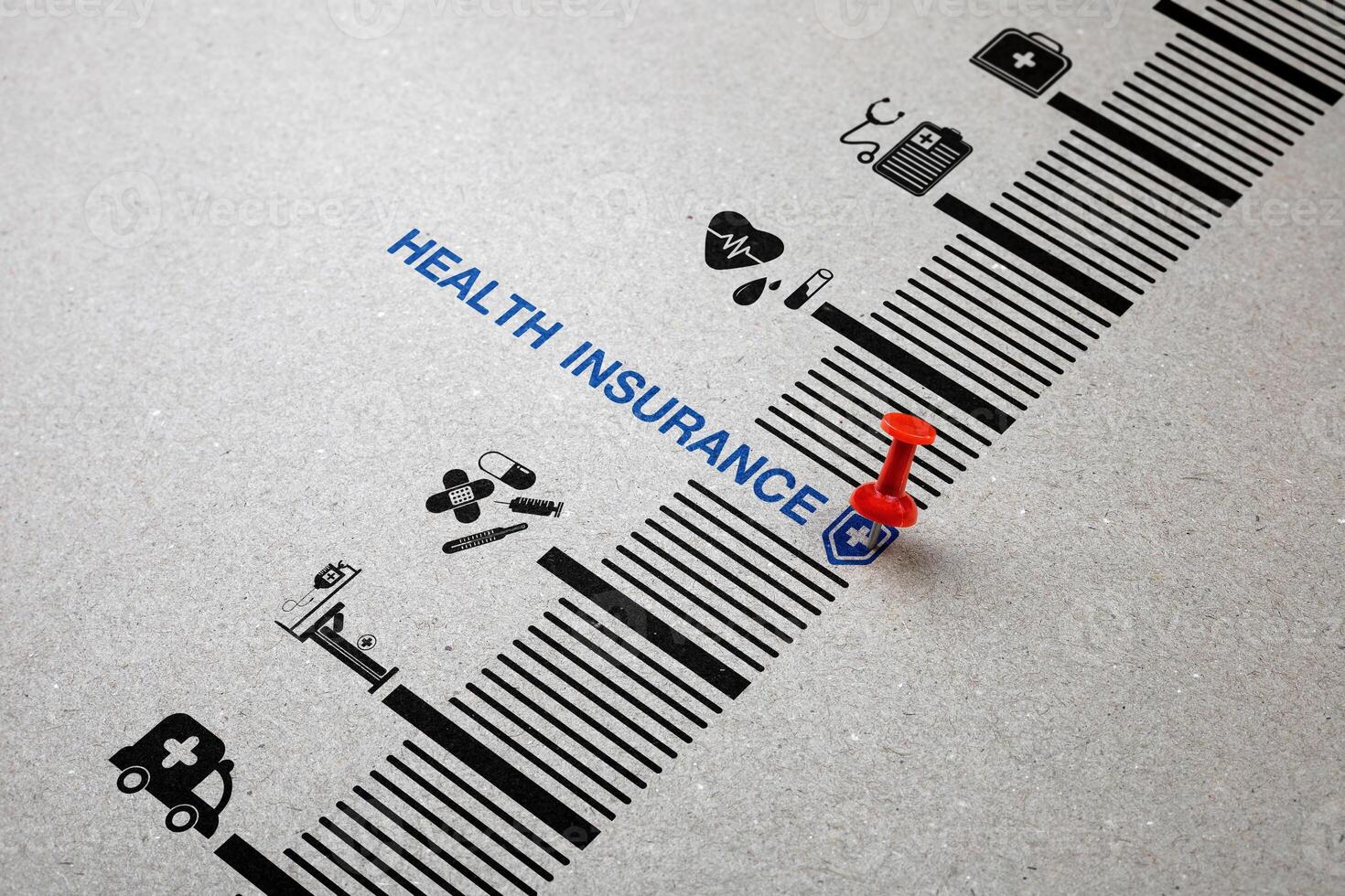 Red pin down word Health Insurance with medical icon on paper. Concept of health insurance planning, financial risk protection for medical expenses, and assisting in managing health risks. photo