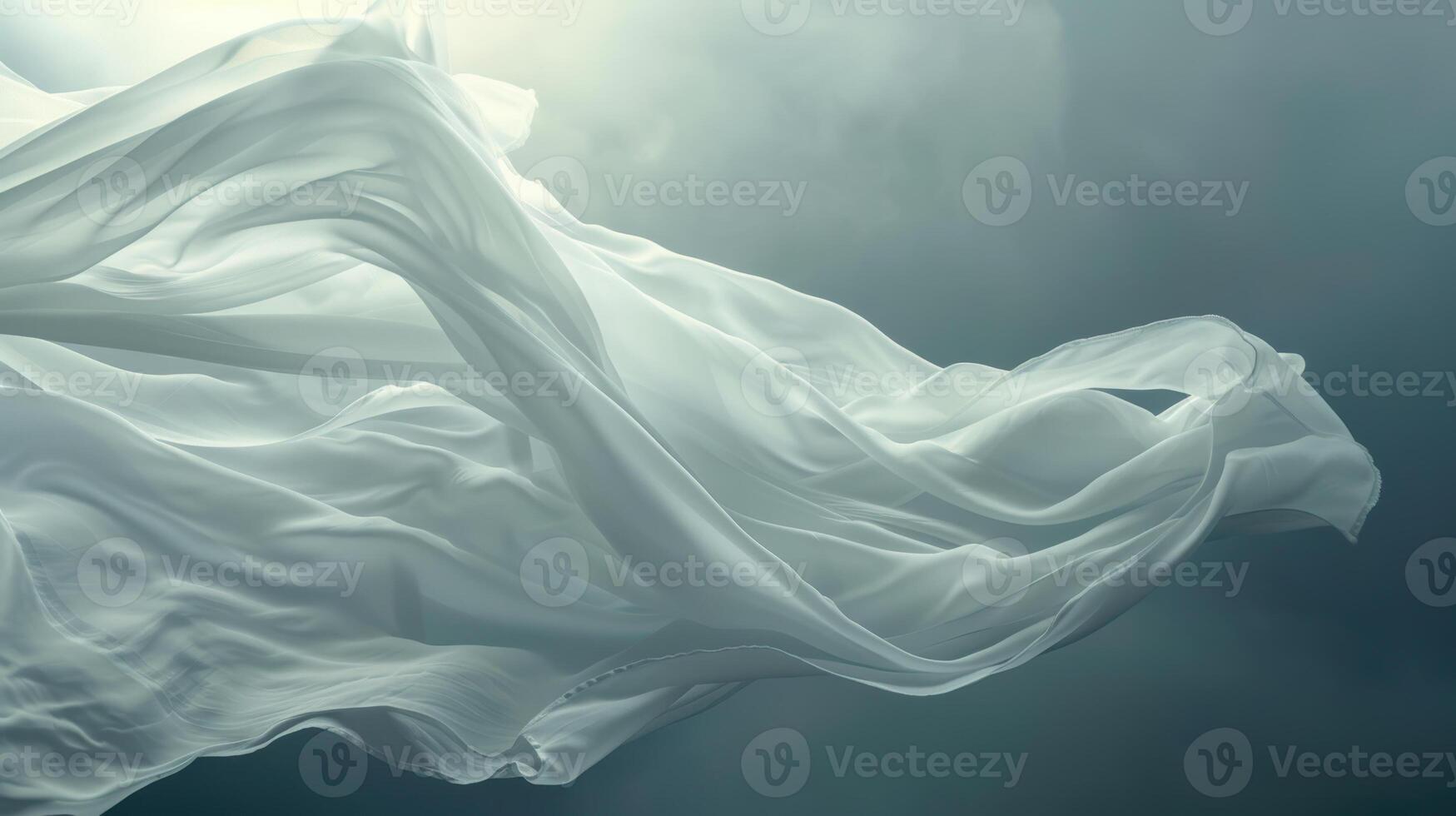 Flowing white fabric against a dramatic cloudy sky photo