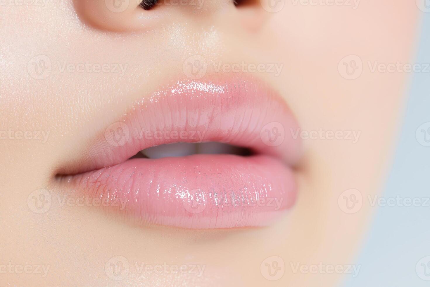 Close Up of Glossy Pink Lips with Natural Skin Tone and Subtle Shine photo
