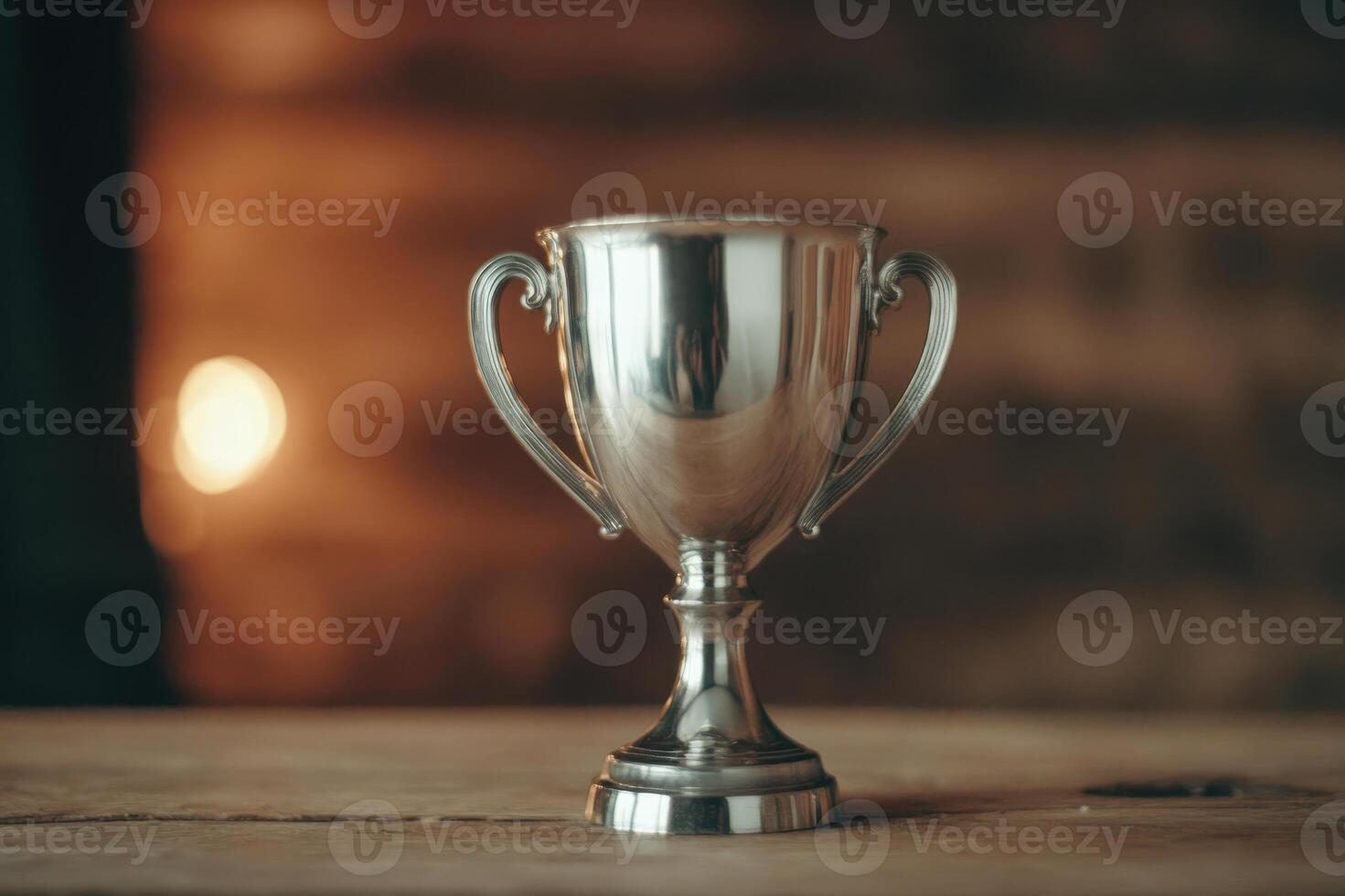 Shiny Silver Trophy on Wooden Table in Rustic Setting photo