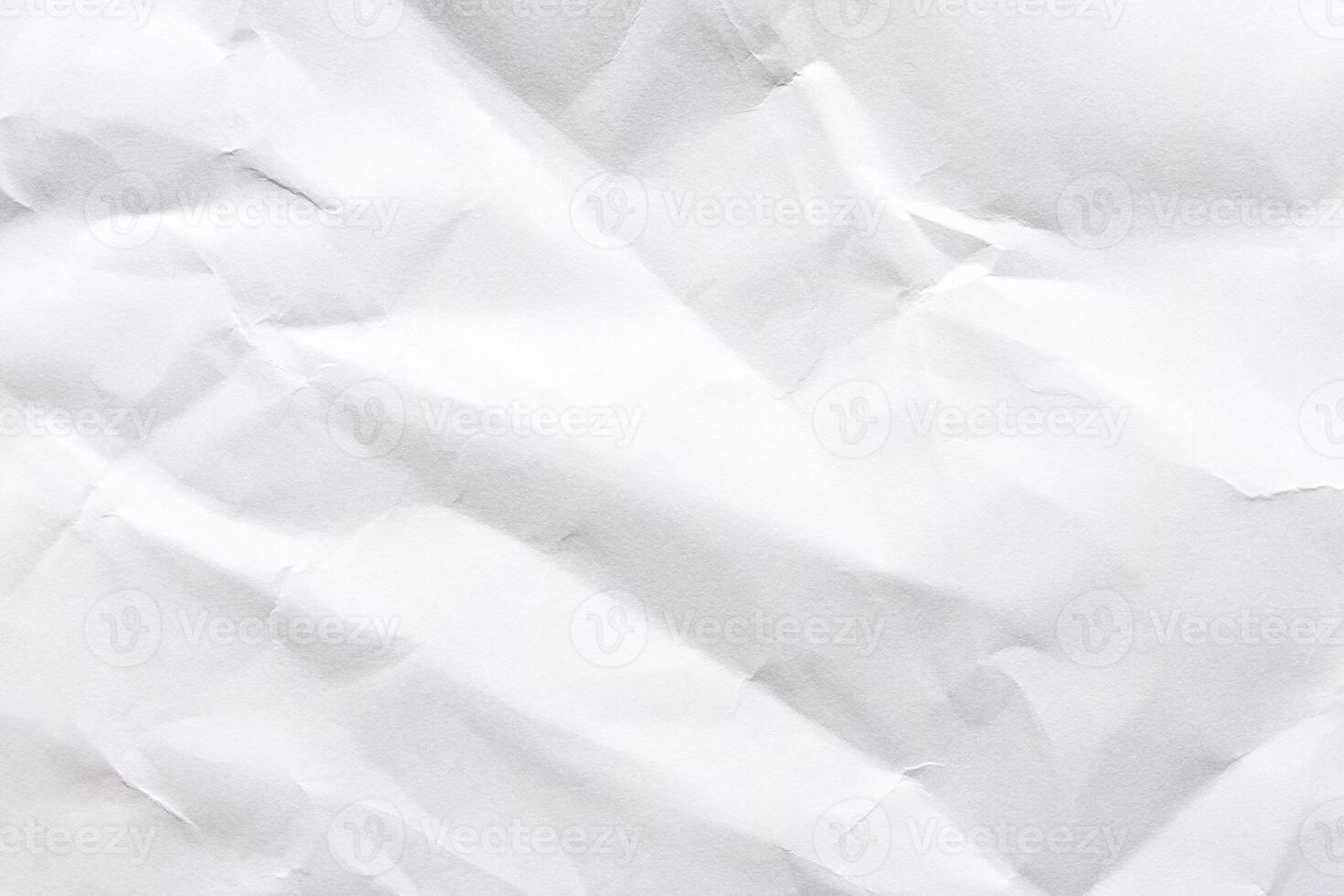 Crumpled white paper texture with folds and creases for background or design elements. photo