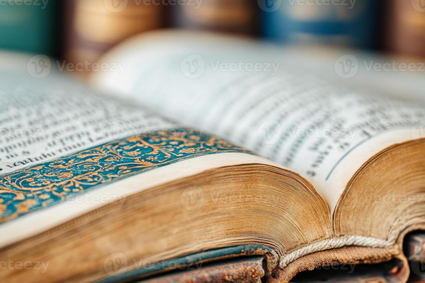 CloseUp of an Open Vintage Book with Decorative Page Edges in a Classic Library Setting photo