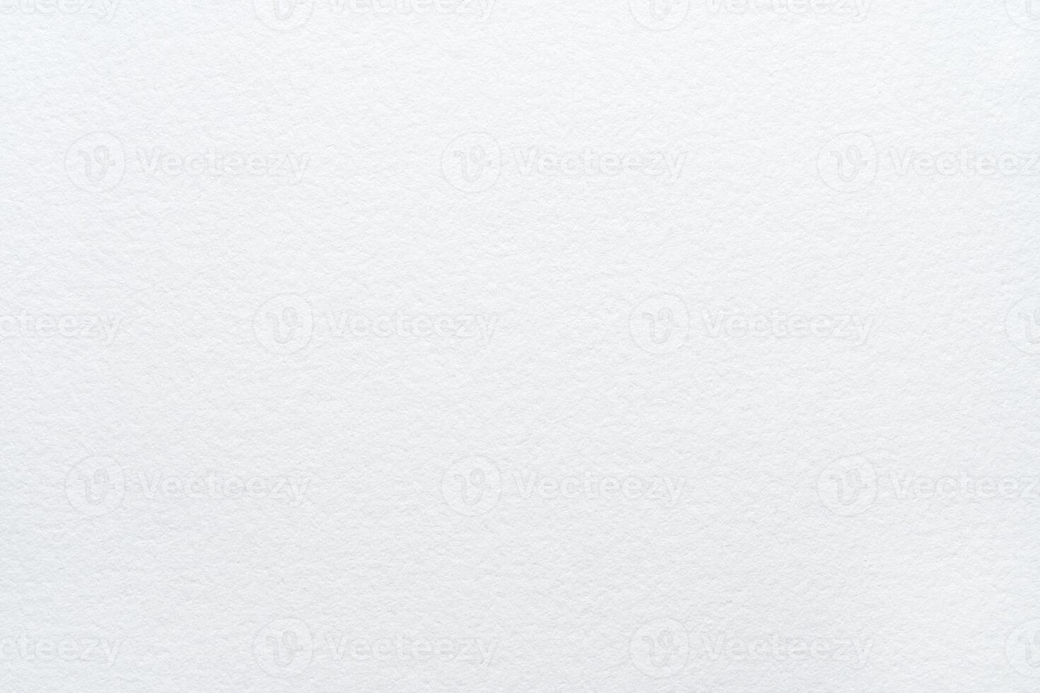 Close-up of blank textured white paper surface with subtle patterns and soft lighting. photo