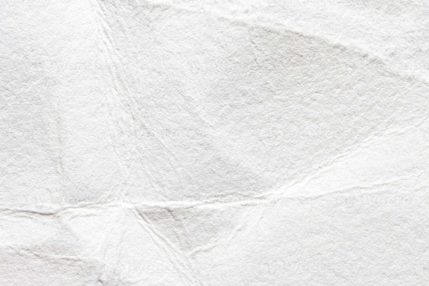 Abstract textured white paper background with creases and folds. photo