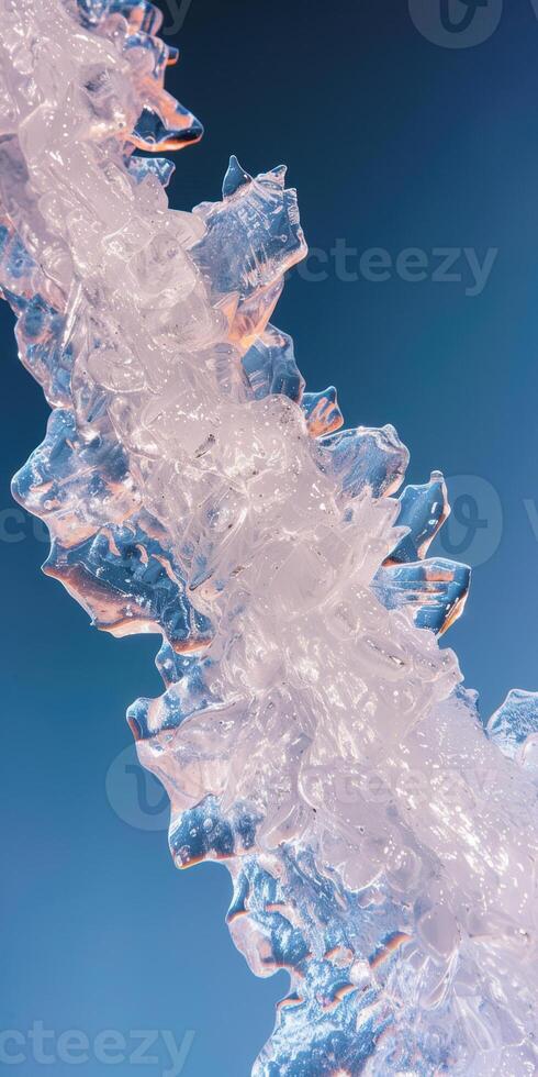 Close up of clear ice structure against a deep blue sky in natural light photo