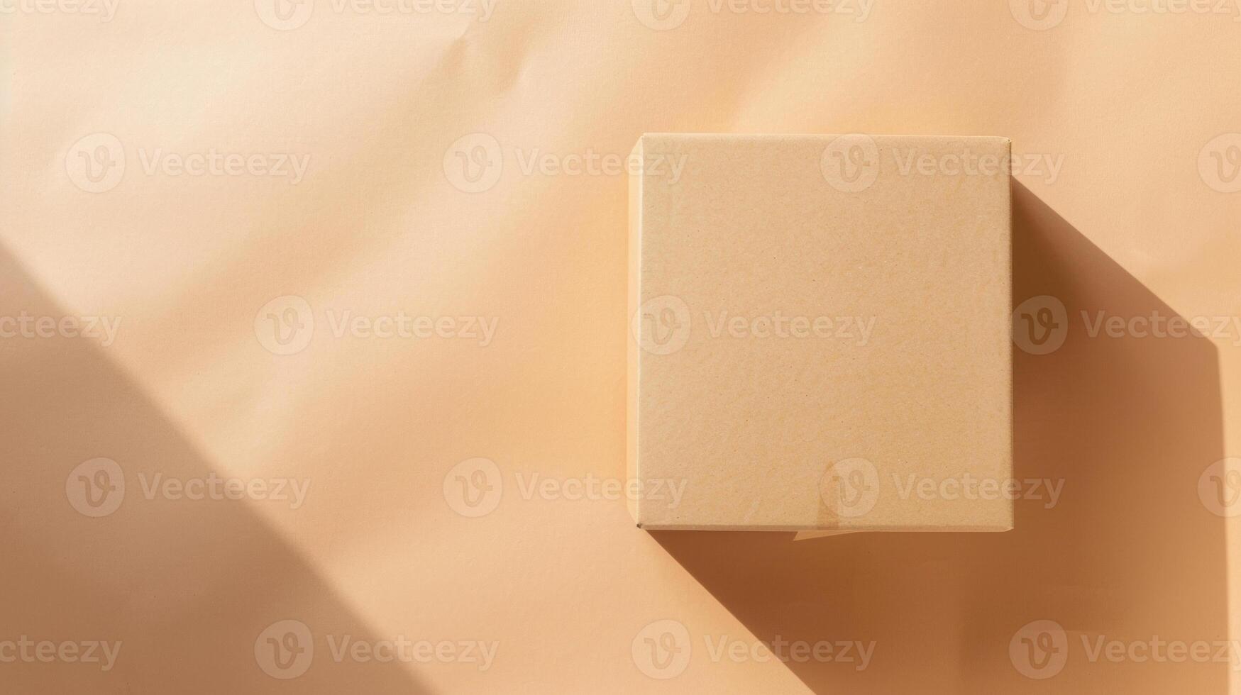 Minimalist Beige Box on Textured Surface with Dramatic Shadows and Warm Lighting photo