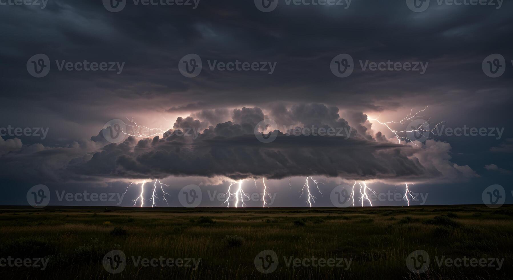 Powerful Thunderstorm with Multiple Lightning Bolts Striking the Horizon Over a Vast Grassland photo