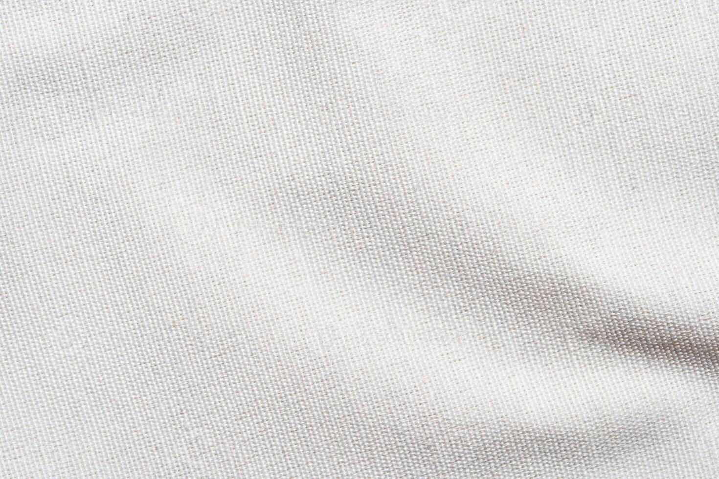 Close-up of white cotton fabric texture with detailed weave and soft surface for textile design inspiration. photo