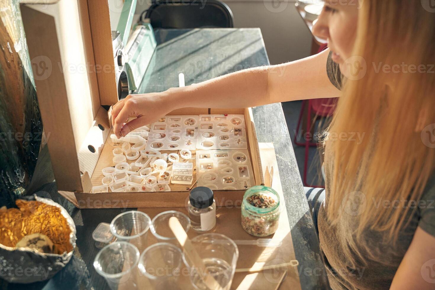 Young caucasian female engaged in science experiment with biological samples in laboratory setting. photo