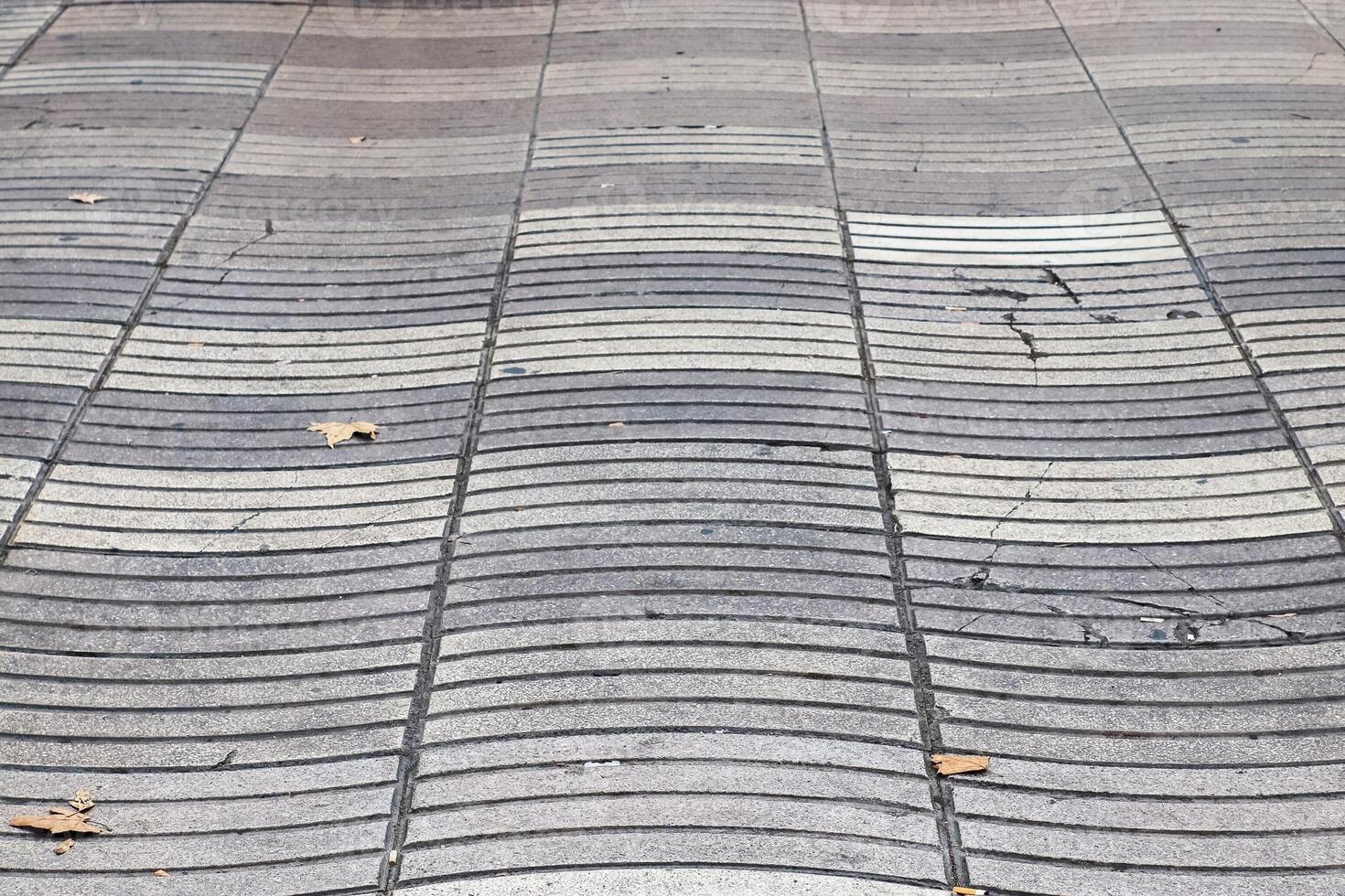 Wavy tactile paving creating an interesting urban pattern photo