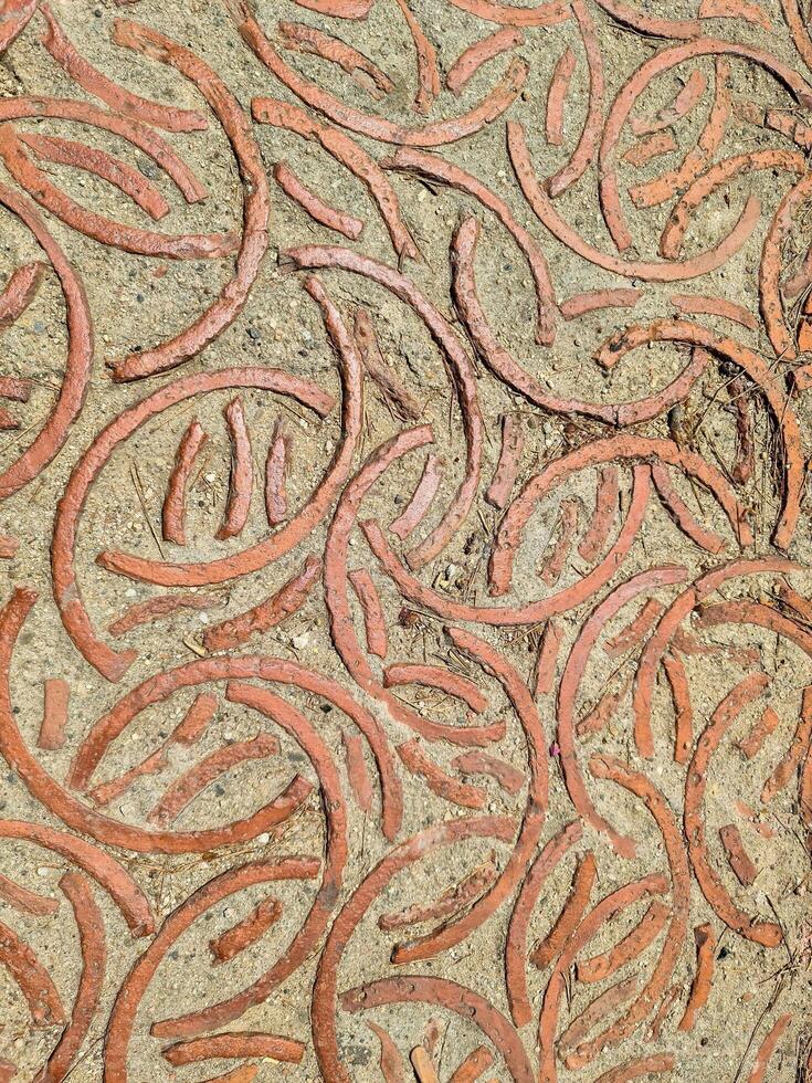 Decorative brick pattern creating concentric circles on a pathway photo