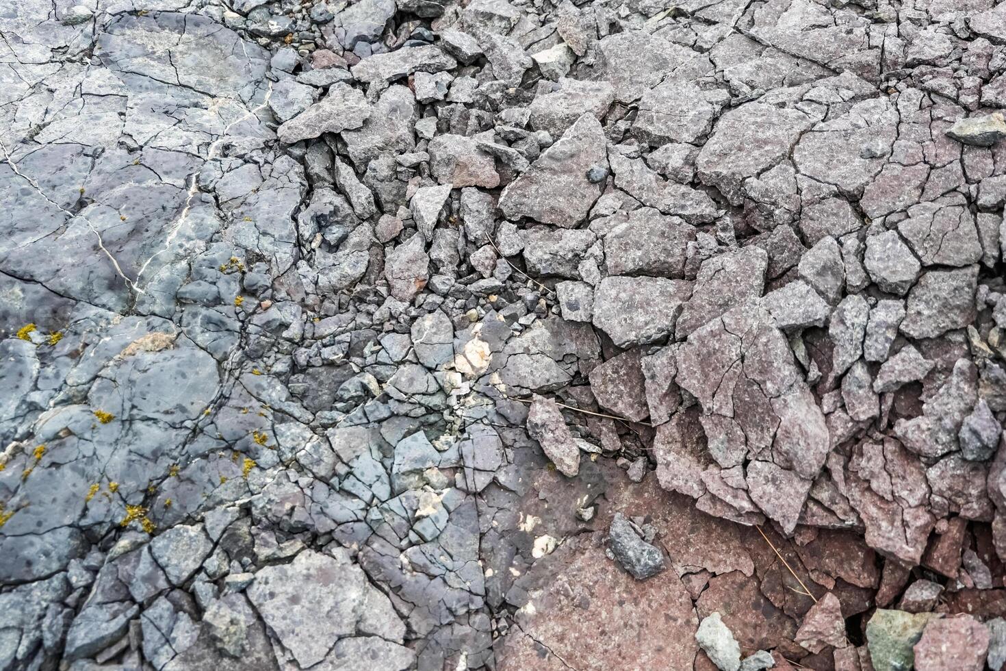 Basalt rock showing different textures and cracks in iceland photo