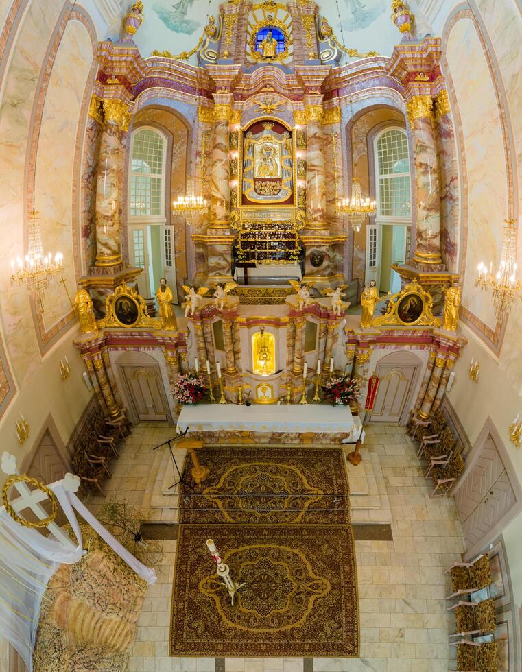Riga, Latvia, 2024 - Ornate Baroque Interior of a European Cathedral with Altar View photo