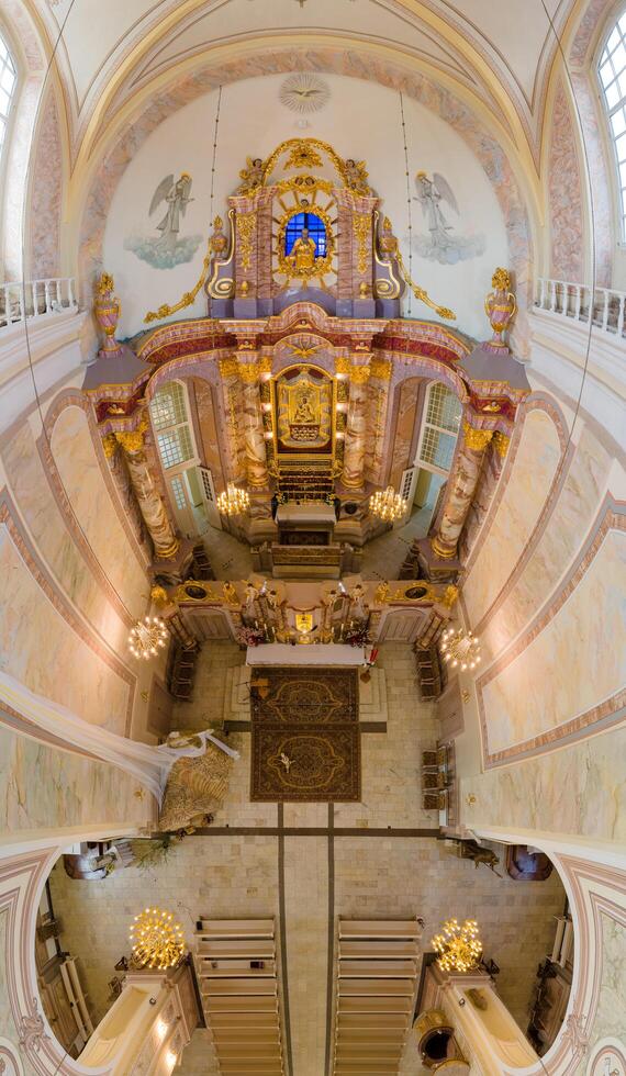 Riga, Latvia, 2024 - Aerial View of Cathedral Interior with Ornate Altar and Columns photo