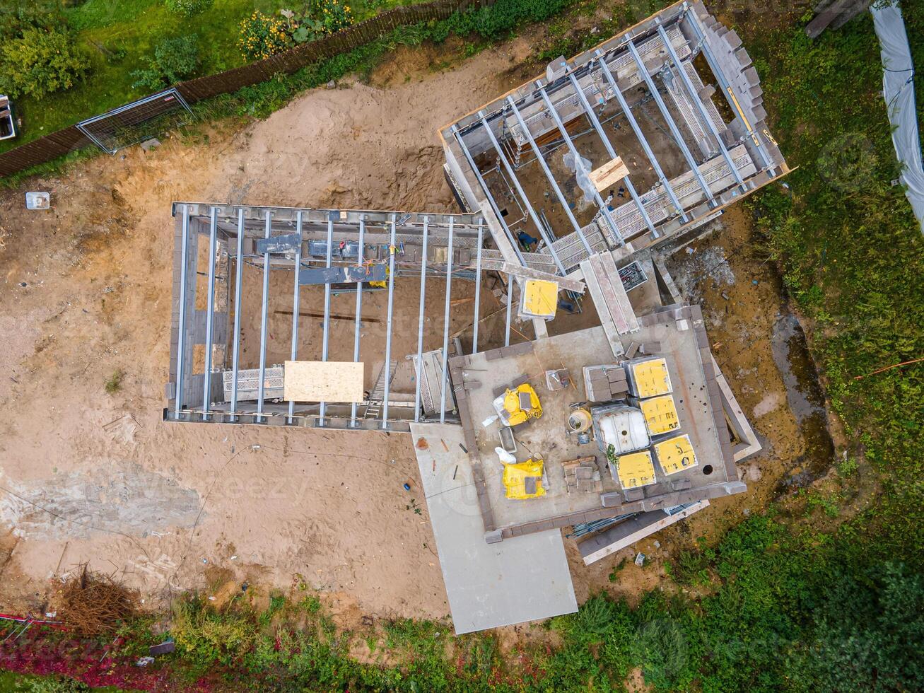 Aerial View of Construction Site with Steel Framework and Materials photo
