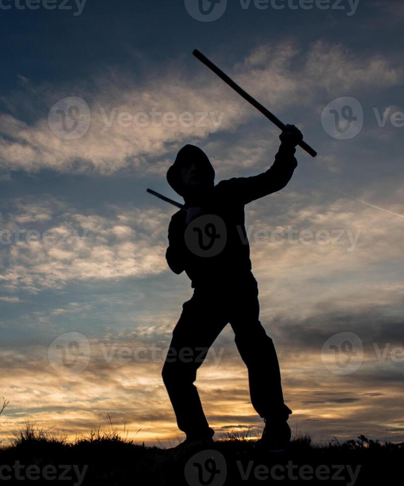 Training with poleson the top of the mountain photo