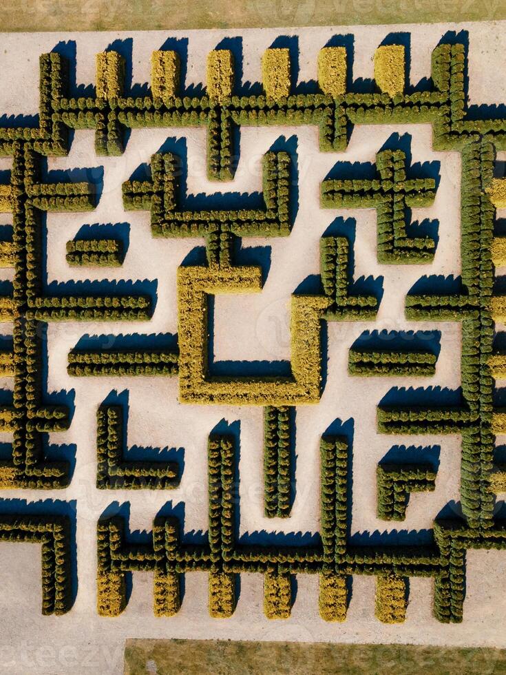 Aerial View of a Geometric Hedge Maze with Central Square Enclosure photo