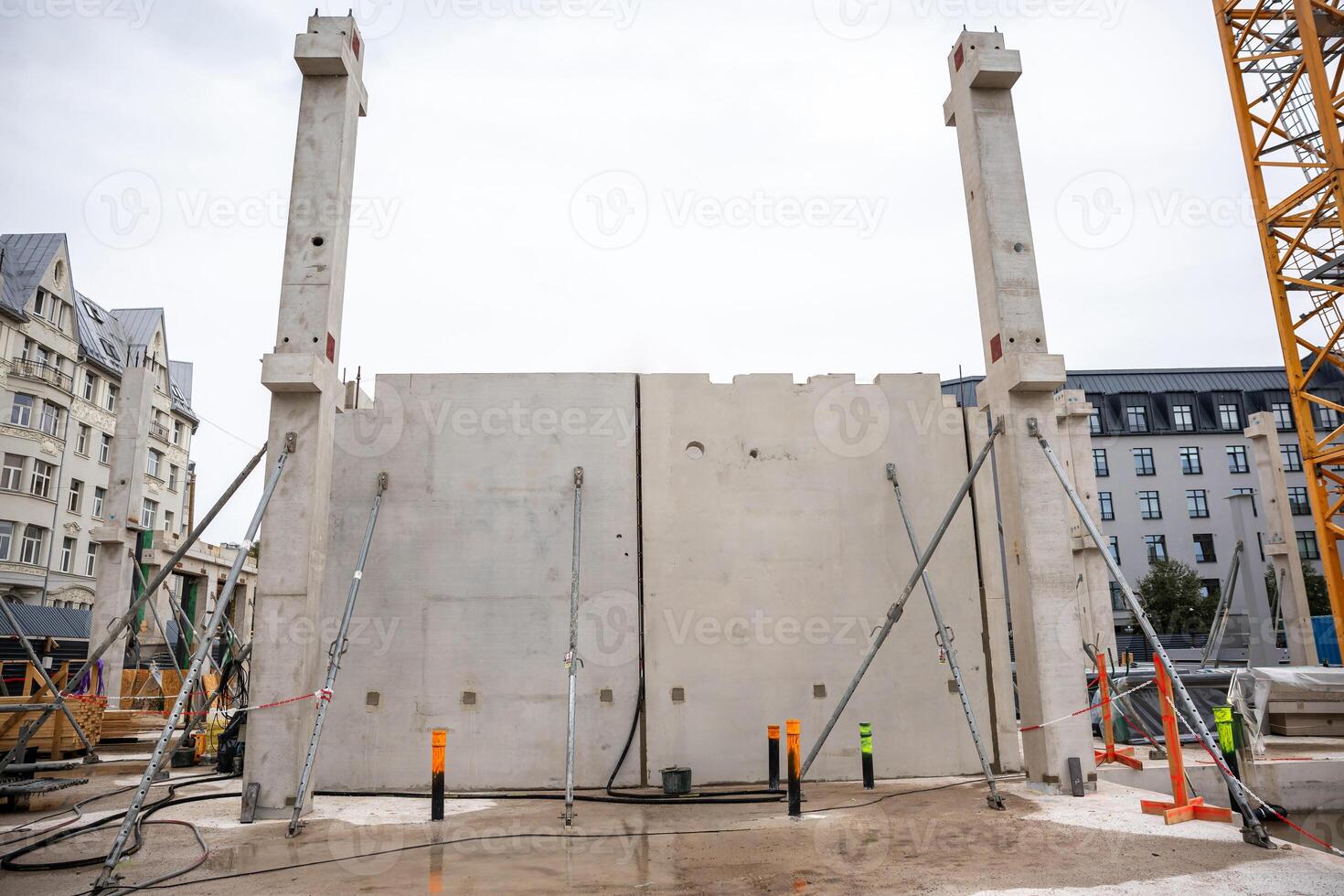 Urban Construction Site with Concrete Wall and Metal Braces photo