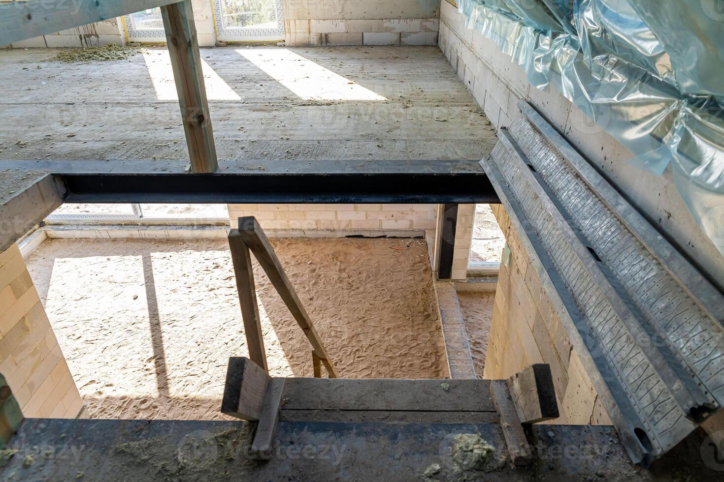 Interior of a Building Under Construction with Visible Brickwork photo
