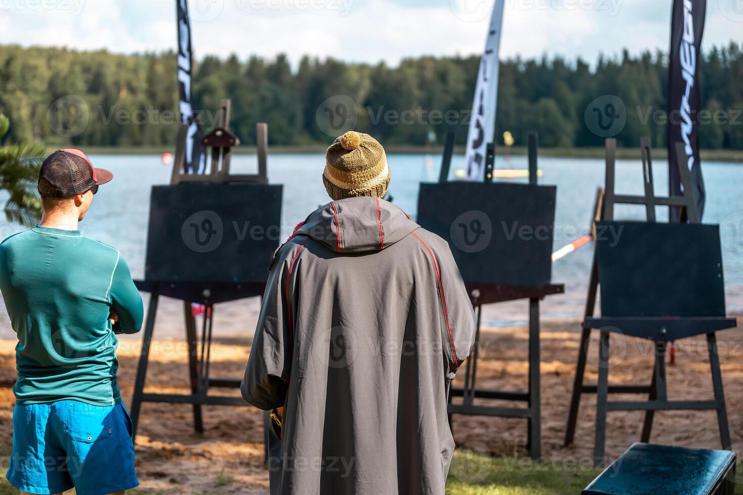 Lakeside Art Session with Blank Easels and Forest Backdrop photo