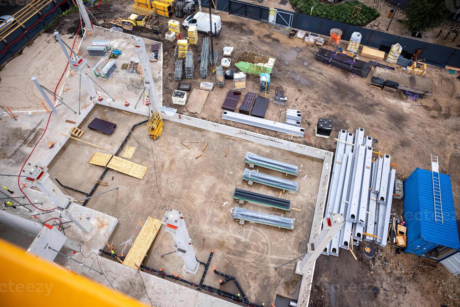 Aerial View of Active Construction Site with Foundation and Equipment photo