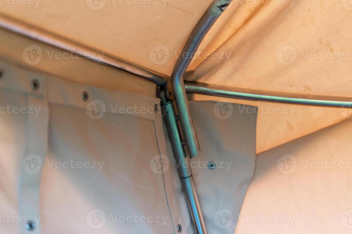 Close Up of Tent Interior Corner with Metal Frame and Fabric Details photo
