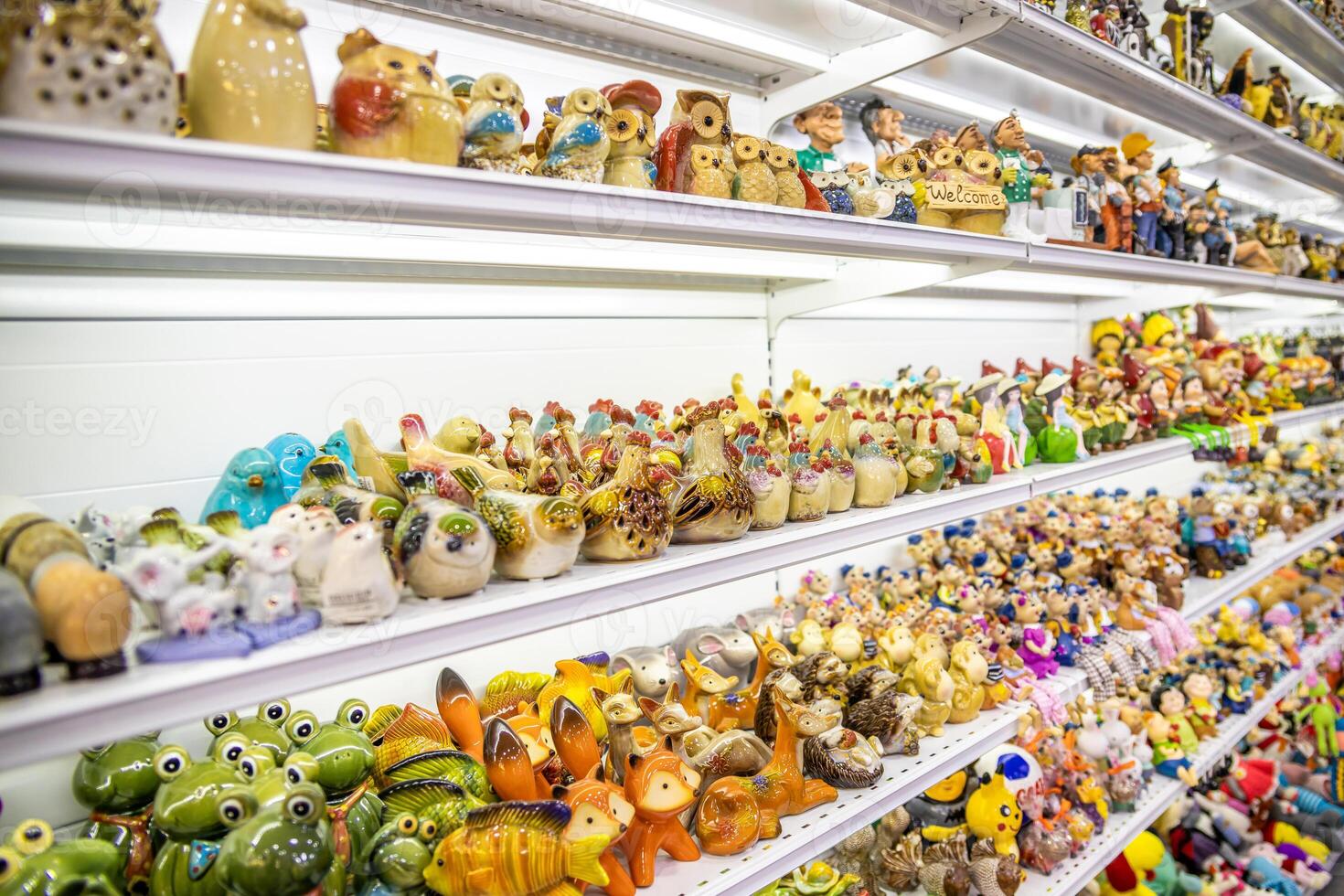 Shelves Displaying Colorful Ceramic and Glass Figurines photo