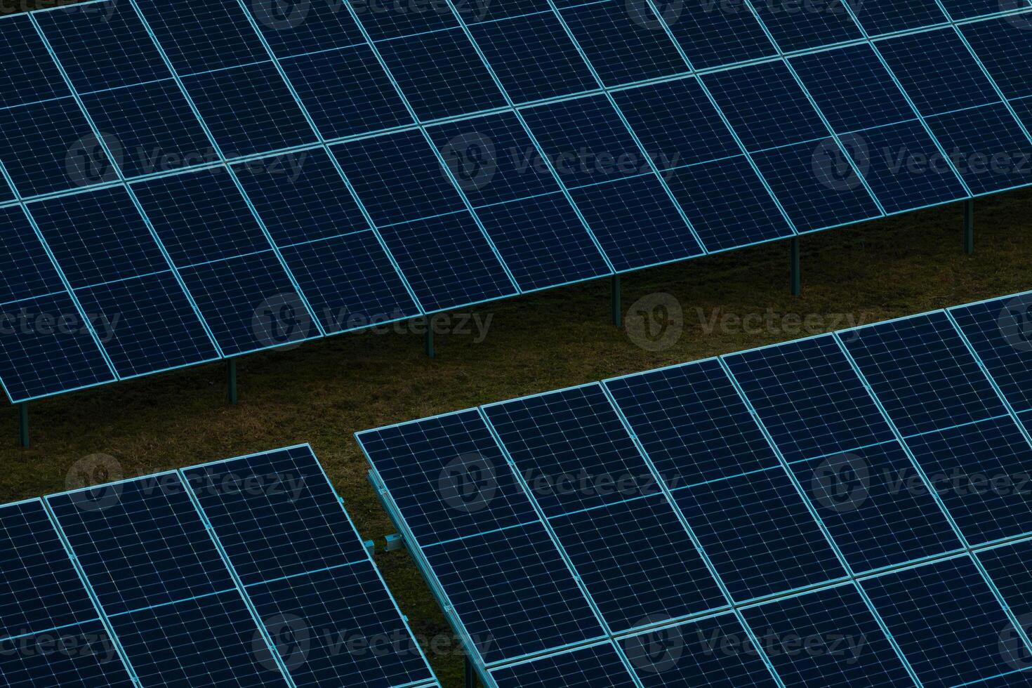 Solar Farm with Rows of Photovoltaic Panels Elevated on Supports photo
