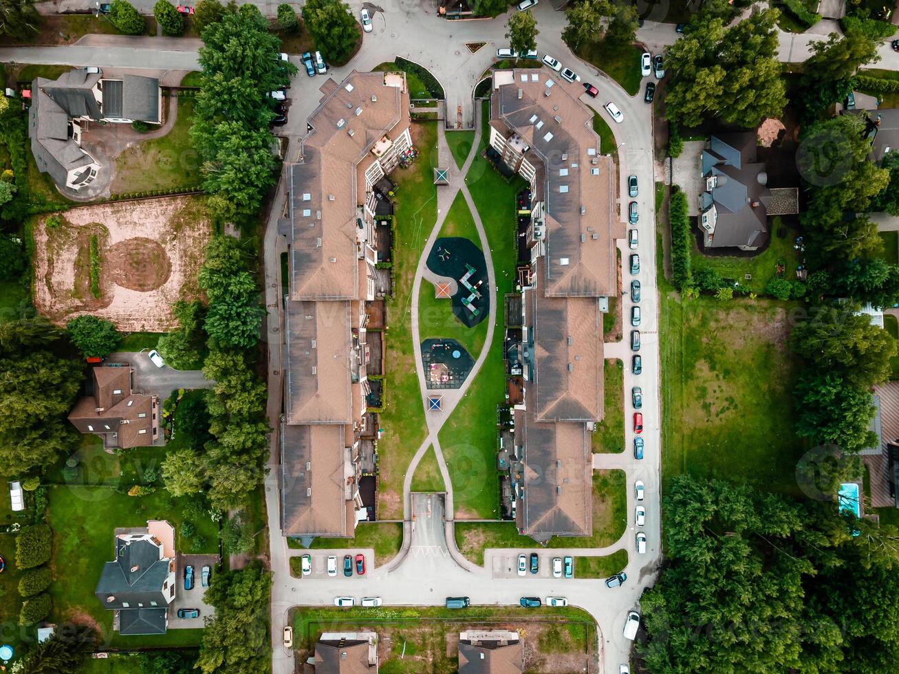 Aerial View of Symmetrical Residential Complex with Central Courtyard photo