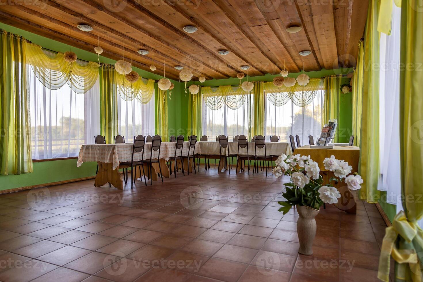 Indoor Dining Area with Green Walls and Wooden Ceiling Decor photo