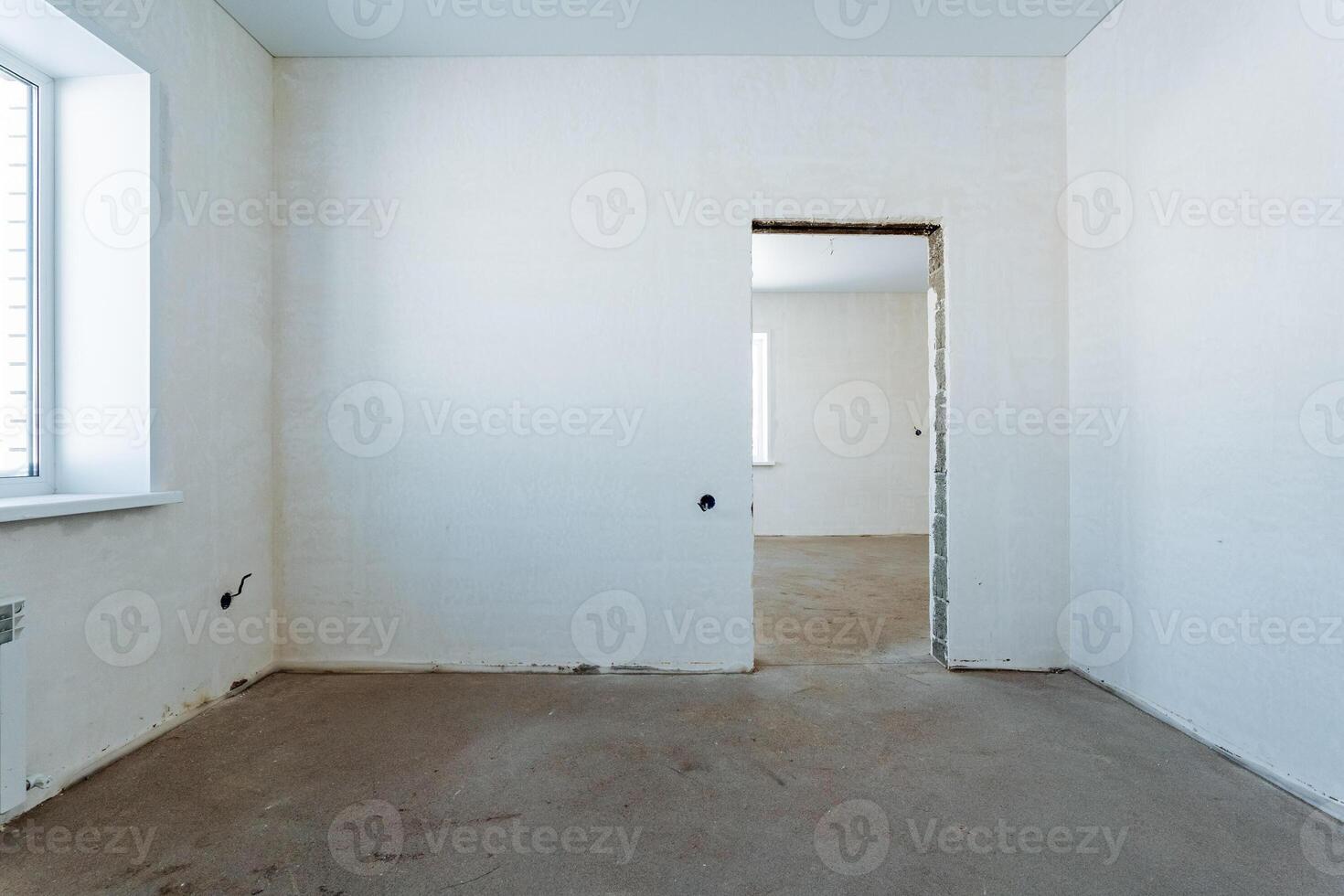 The room has a welldesigned door and large window for natural light, with stunning flooring and elegant ceilings, creating a warm, inviting space for relaxation and socializing photo