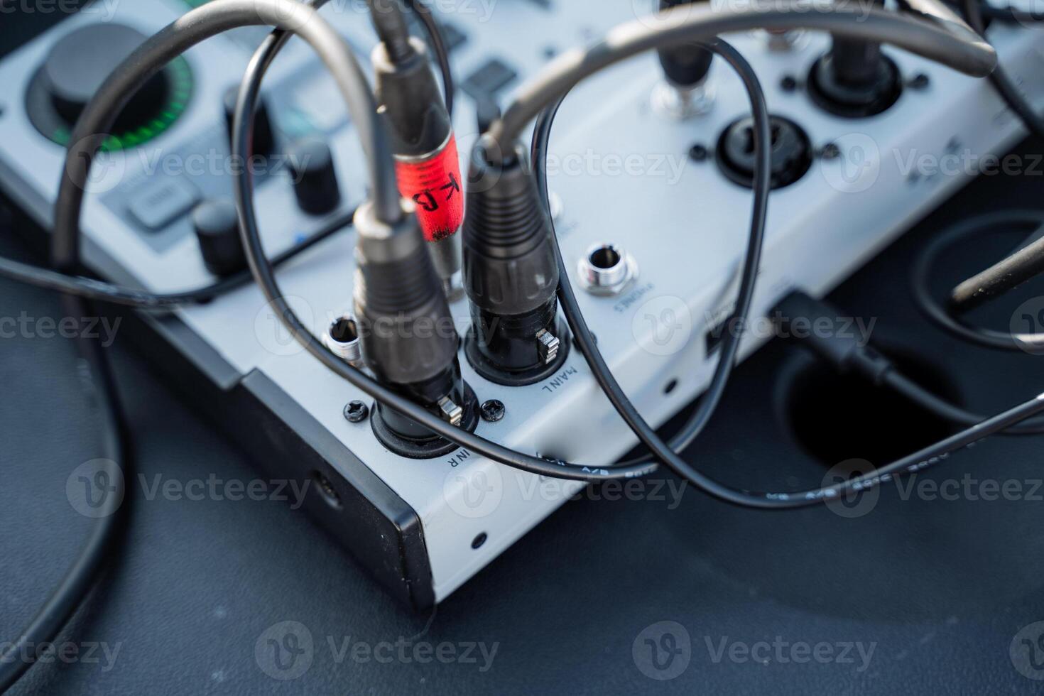A bunch of cables are plugged into a device photo