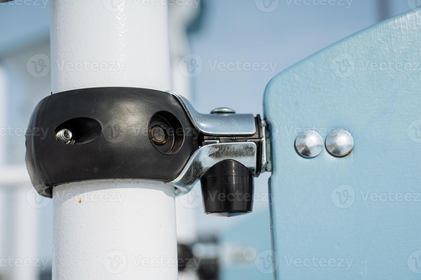 CloseUp of a Durable Playground Equipment Connector on a Bright Sunny Day, Ideal for Community Park Playtime, Perfectly Designed for Kids Fun, Exercise and Fitness Activities photo