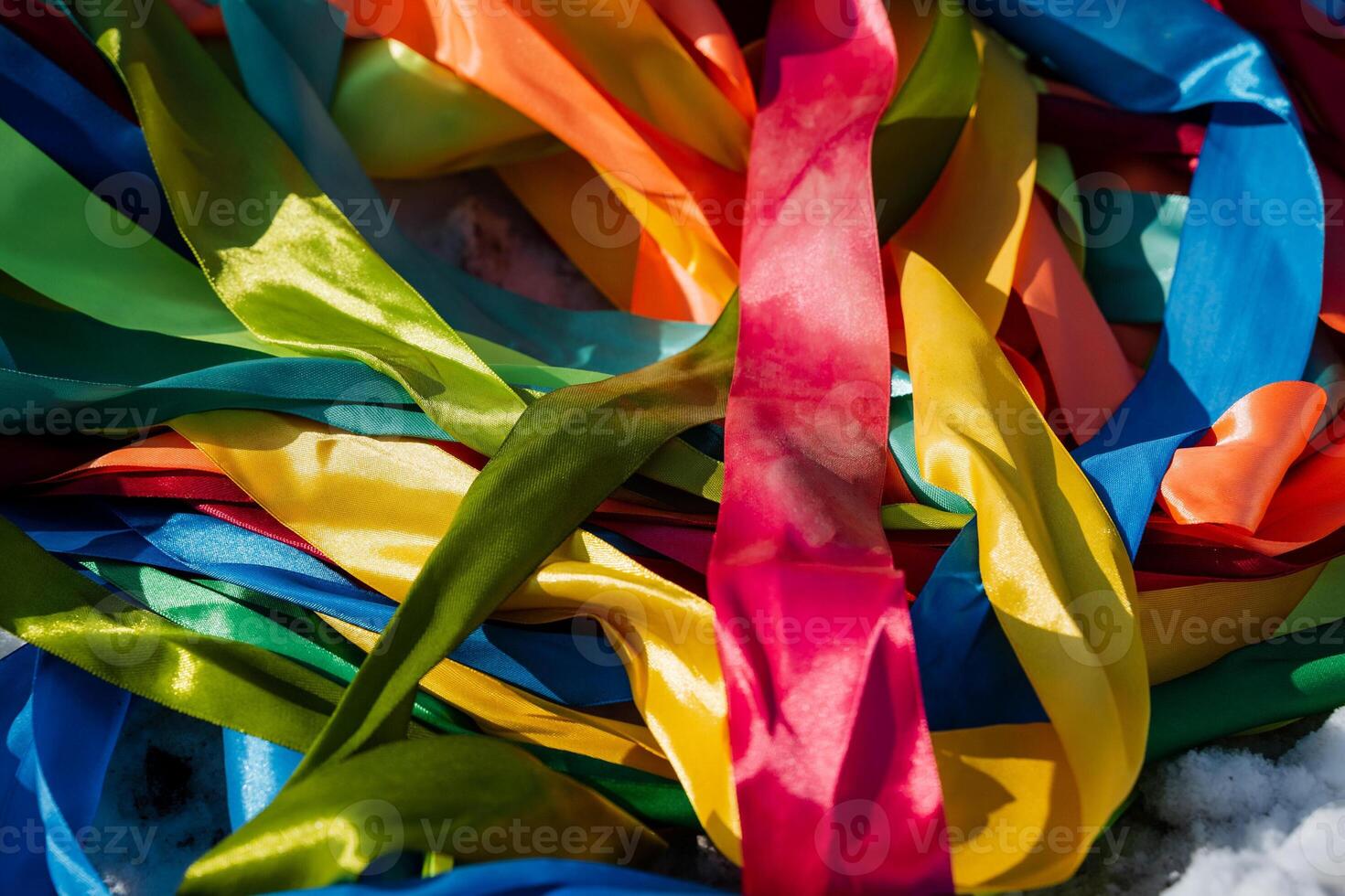 An enchanting array of multicolor ribbons, creatively twisted and arranged, creates a stunning display of textures and patterns, adding a festive touch to any setting photo