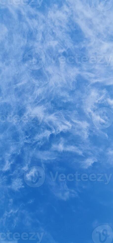 Light blue sky with light clouds photo