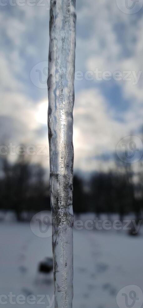 Frozen ice with blue sky and clouds photo