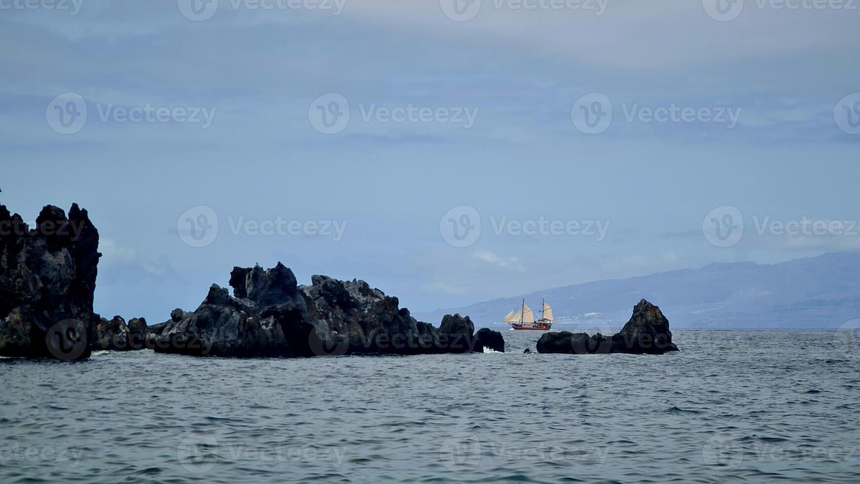 Black rocks in the ocean, Tenerife photo