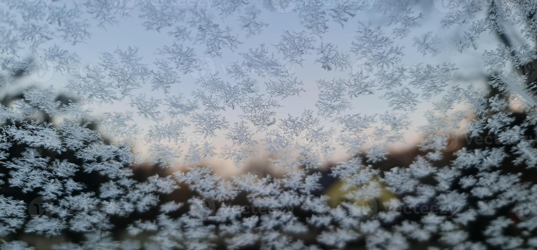 Frozen icy window in car photo