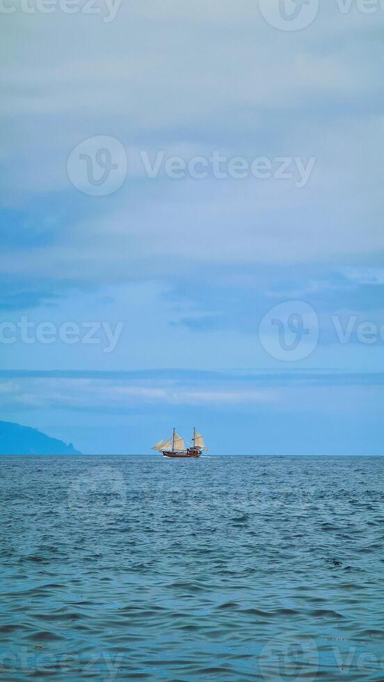 Single vintage ship in the ocean photo