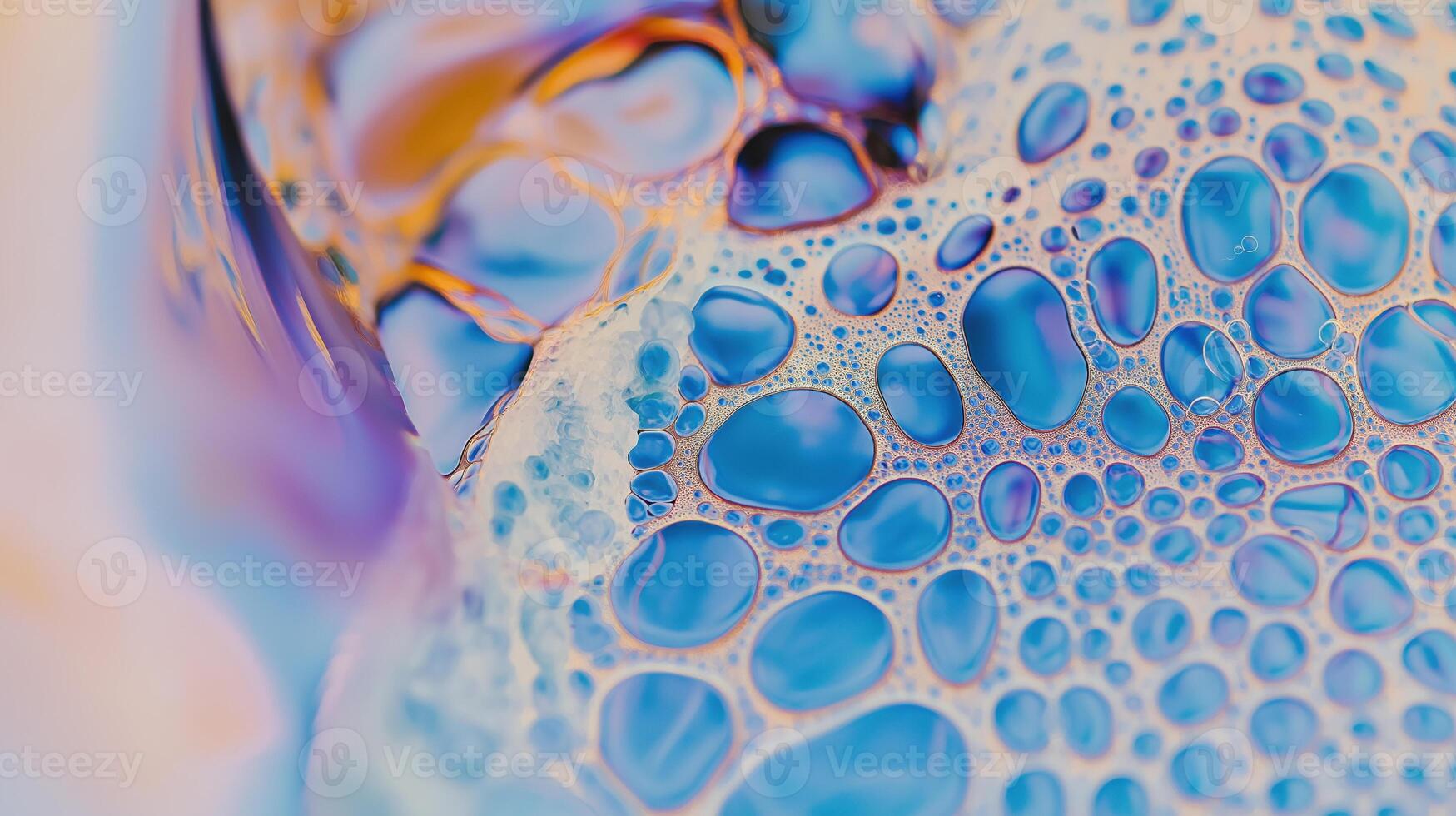 Iridescent bubbles create an abstract pattern with blue and purple translucent hues. photo