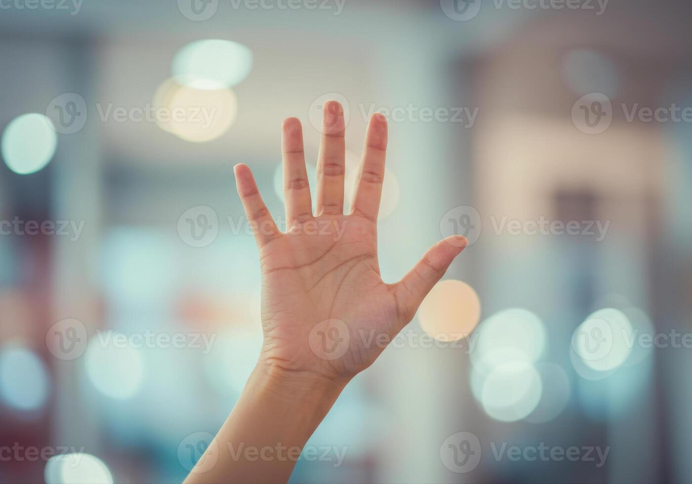 A hand held up, fingers spread, creating a sense of connection and positive affirmation. photo