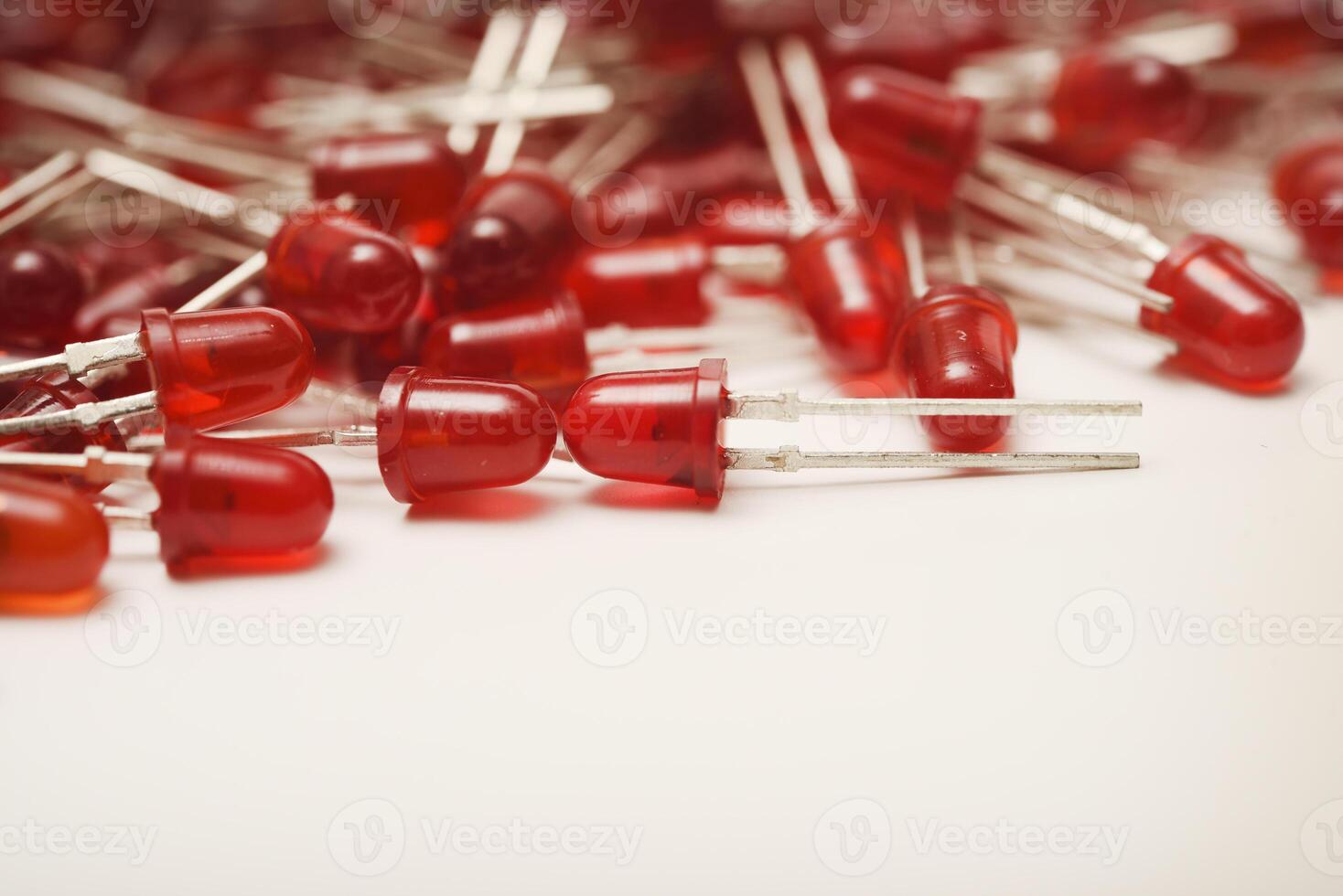 Red LED bulbs on a white background. The radio element is an LED lamp. photo