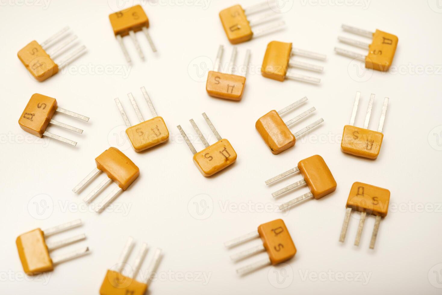 Outdated transistors on a white background. Tech components. photo